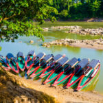 Tourist boats moored on Usumacinta river for Yaxchilan archaeological site, Chiapas, Mexico-Guatemala border